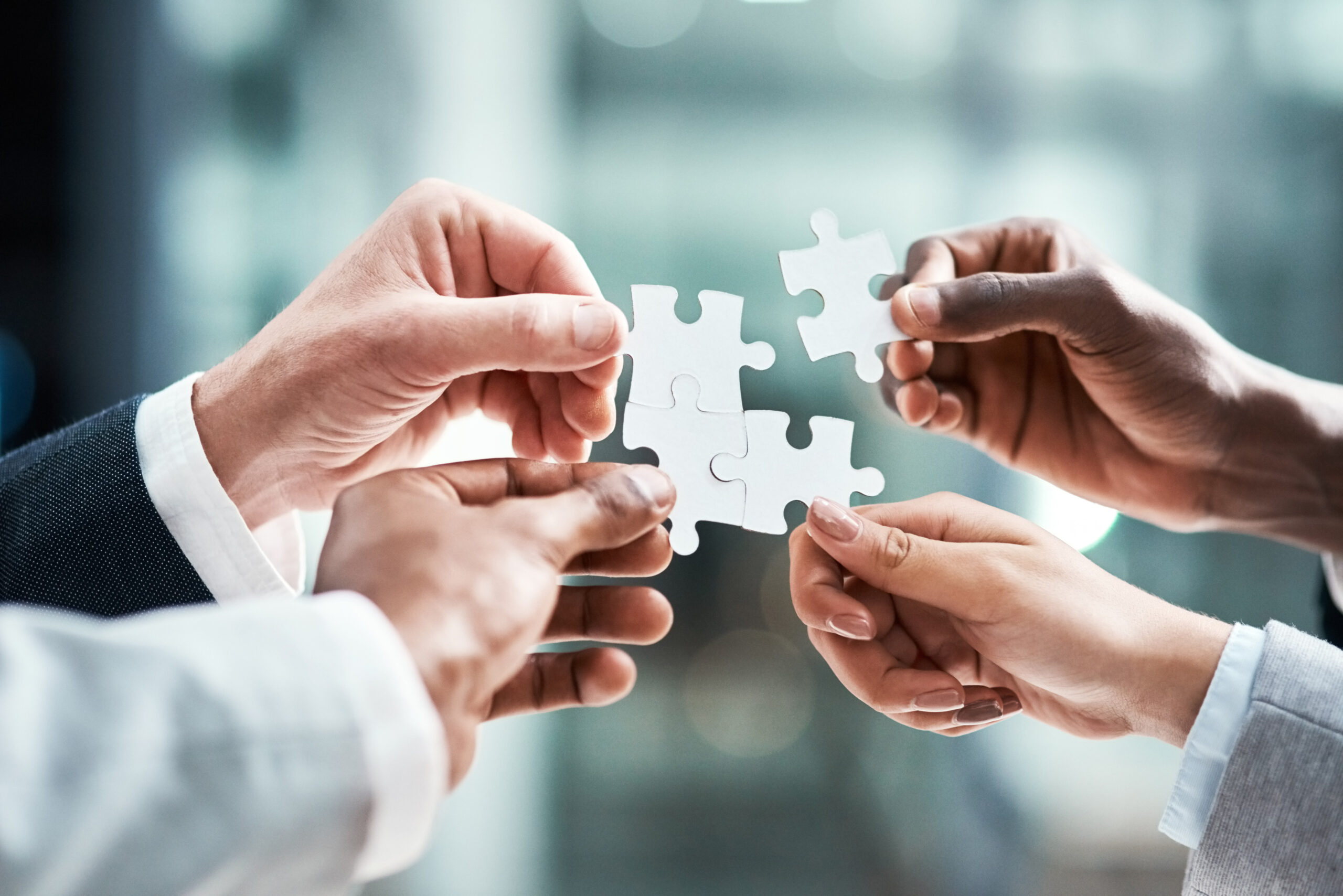 Puzzle, teamwork or group of people hands for solution, business goals and integration of workflow or success. Team building, games and development of person problem solving, synergy or collaboration.